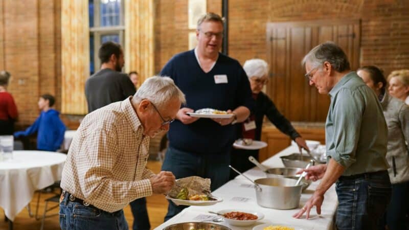 Members of St. John’s Cathedral gather for a shared meal during Cathedral Night, a weekly evening of worship, fellowship and Christian formation in Denver.